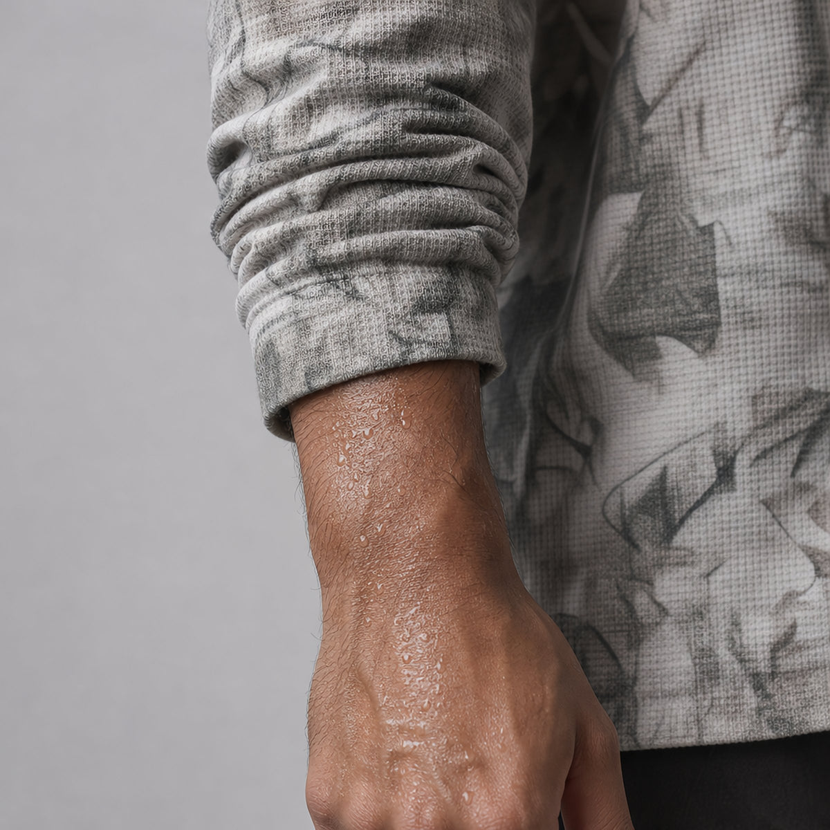 Grey camo oversized long-sleeve T-shirt - cuff pushed up on damp skin